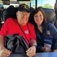 Judge Barber sitting inside a bus next to United States Army veteran Sandy Parrott